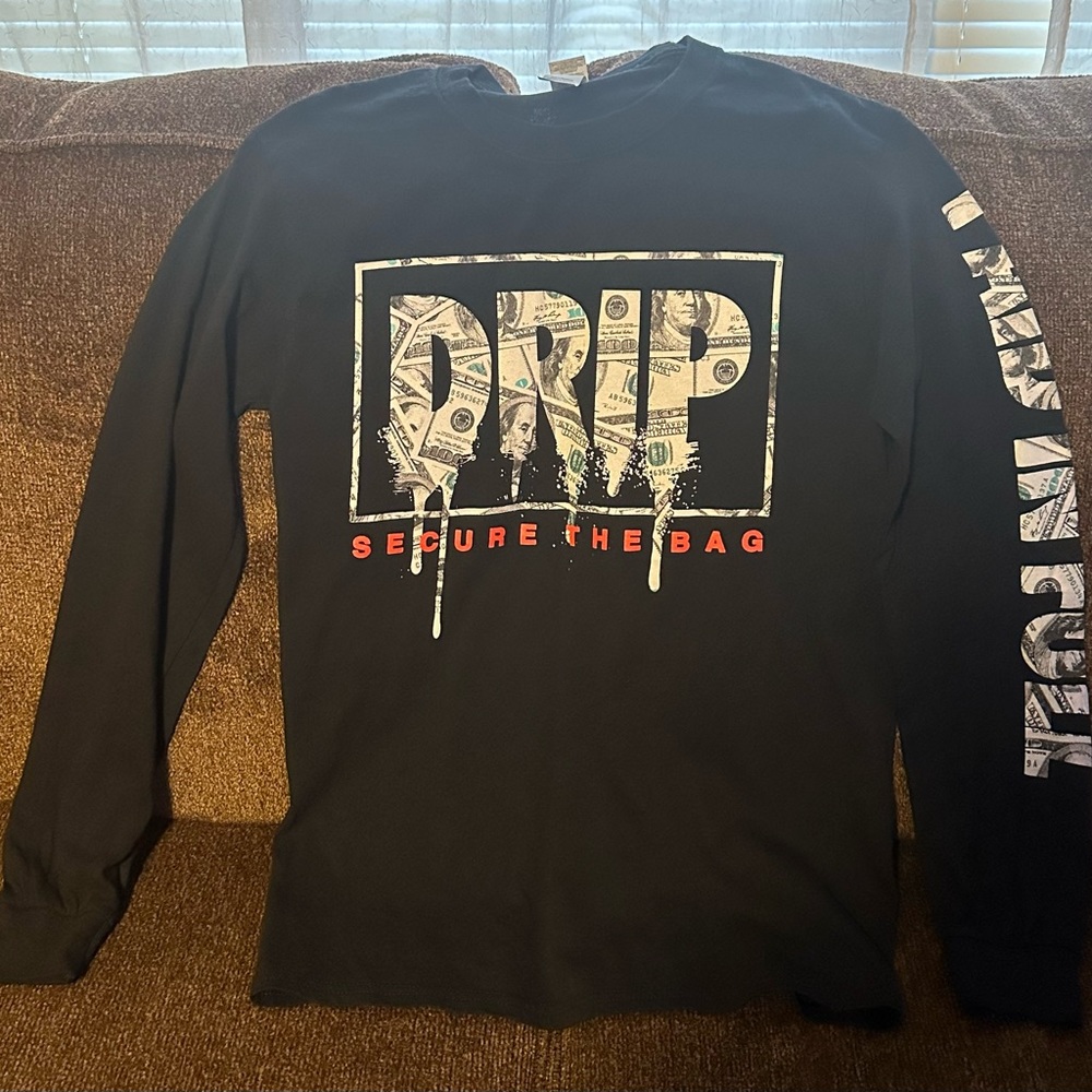 Boy’s long sleeve money design shirt.  Pet/smoke free home.